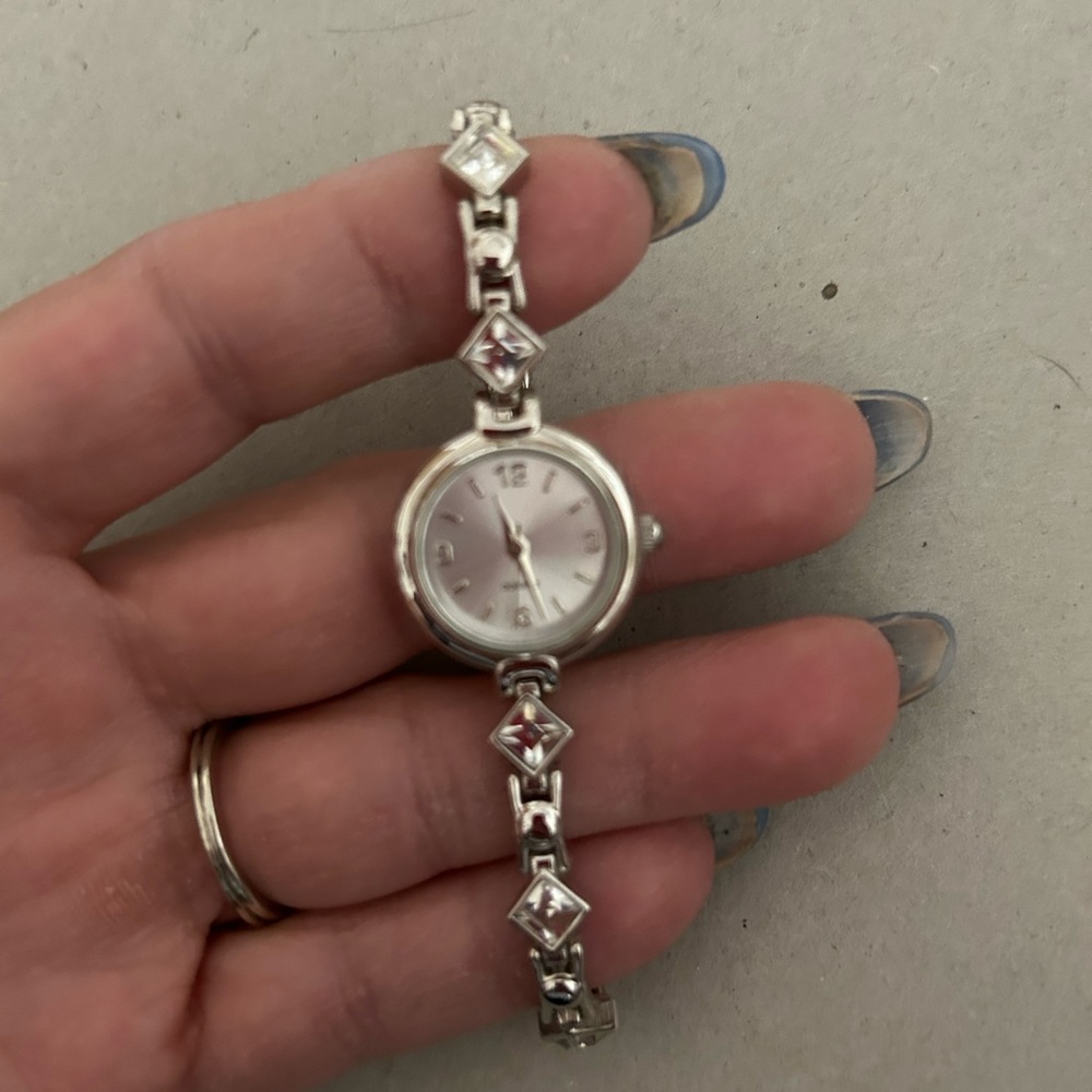 Women’s vintage Avon watch. Silver tone with clear crystals in diamond shapes.